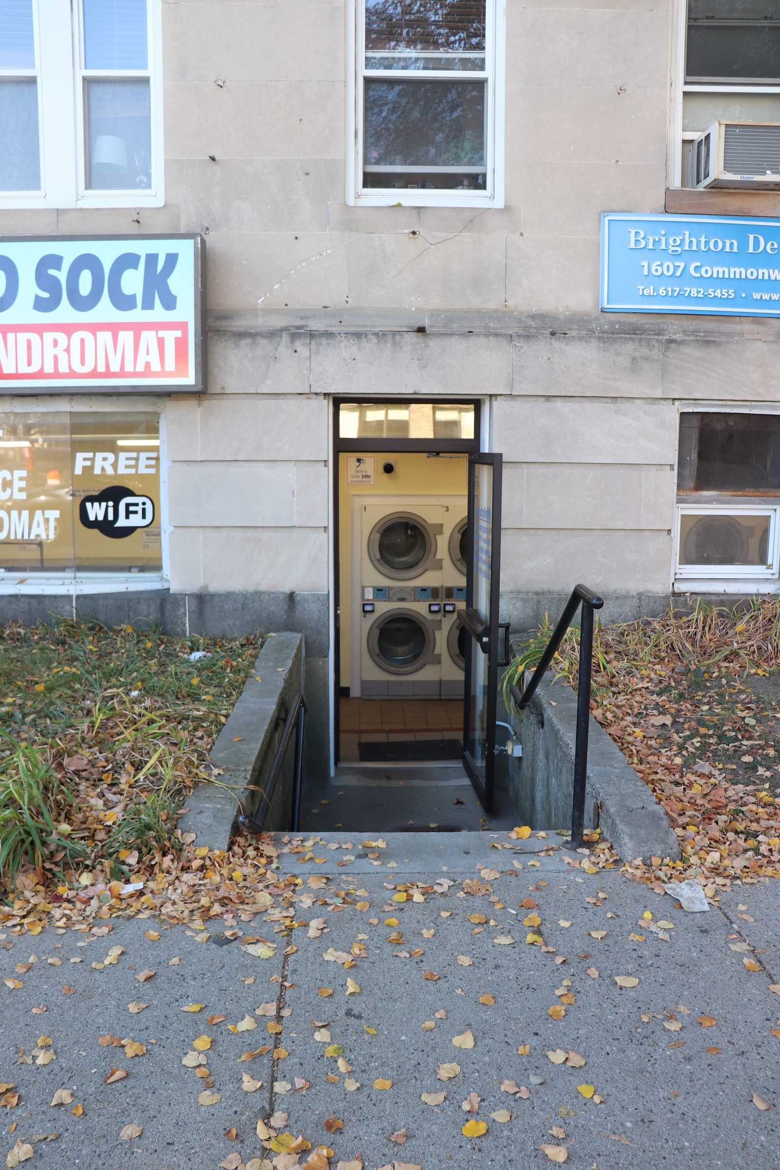 Storefront with entrance and stairs down