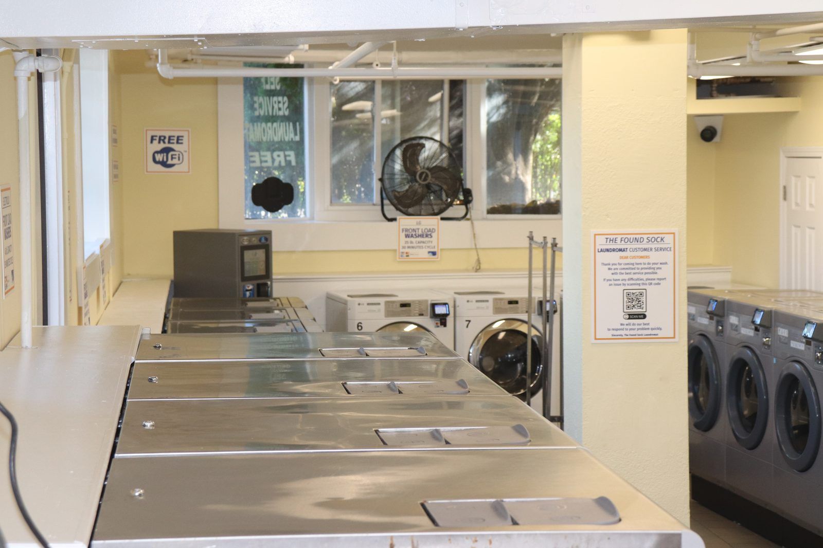 Dryer wall with payment terminals on each